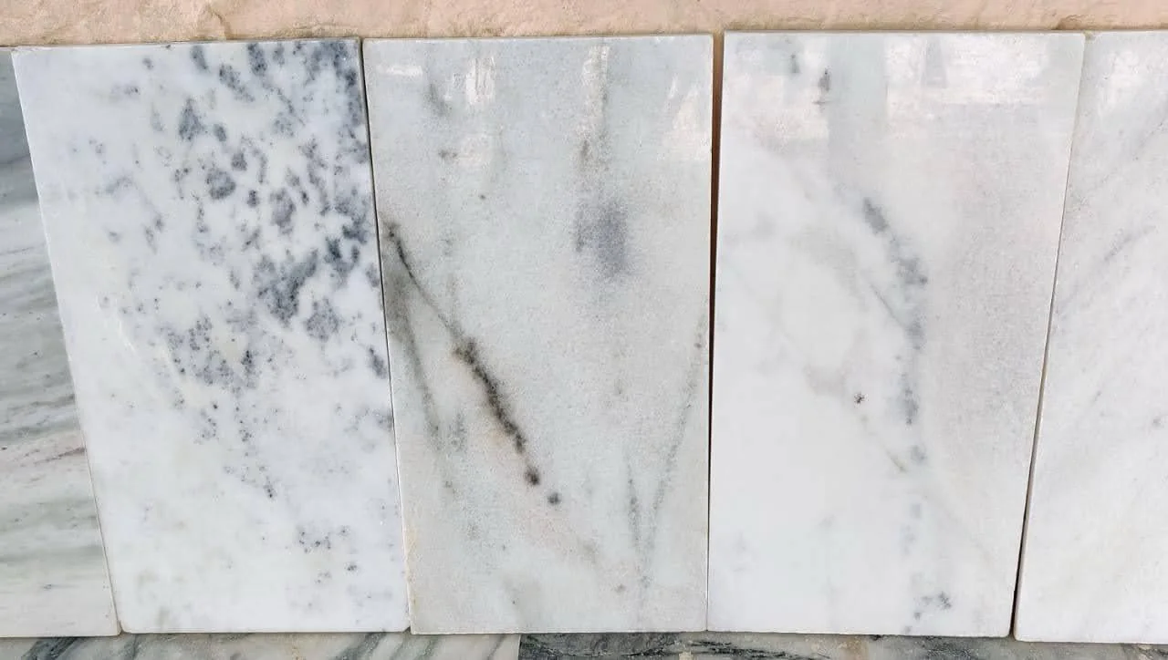 Finished white marble tiles laid out side by side